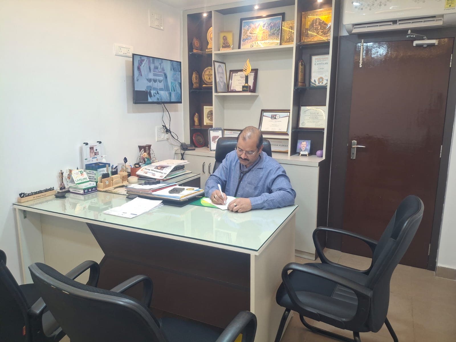 Dr. Amitesh Kumar at his consultation desk